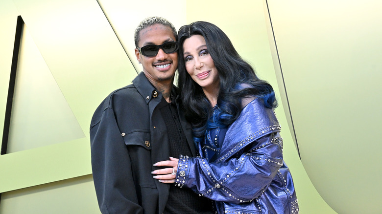 Alexander Edwards and Cher posing 