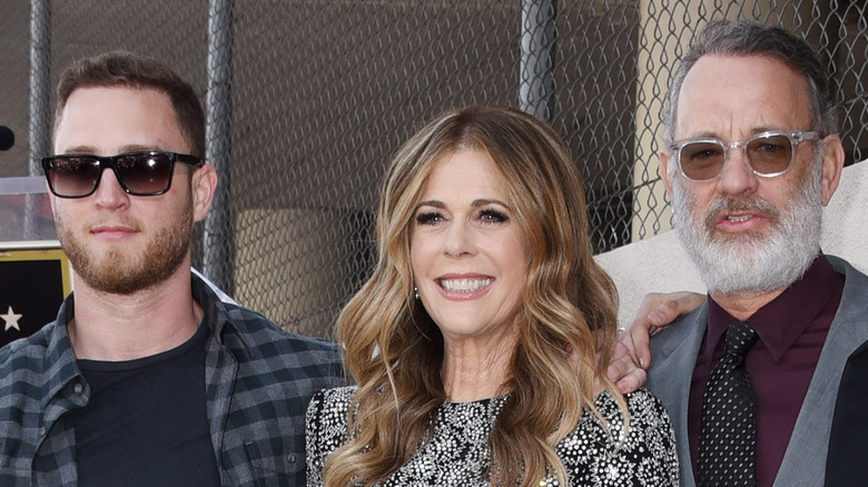 Chet Hanks posing with parents Rita Wilson and Tom Hanks