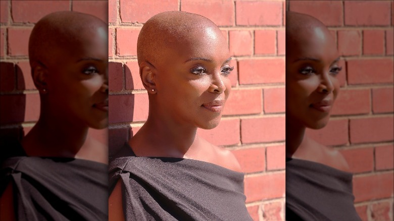 Marlyne Barrett posing with shaved head