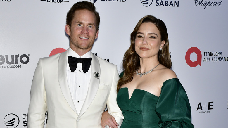 Grant Hughes and Sophia Bush arm-in-arm