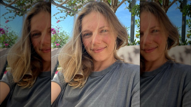 Tracy Spiridakos smiling outdoors