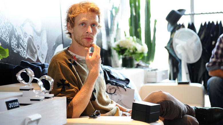 Johnny Lewis sitting with watches at TIFF