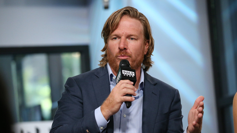 Chip Gaines speaking into a mic