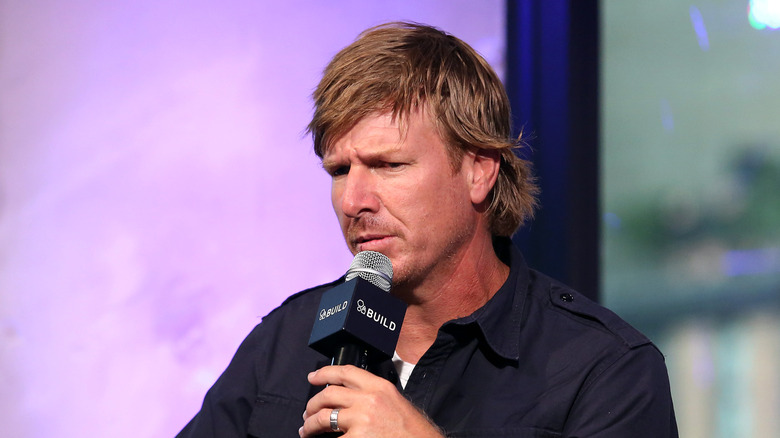 Chip Gaines holding a mic