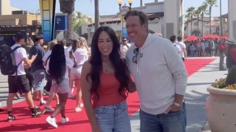 Joanna and Chip Gaines smile awkwardly at Universal Studios Hollywood