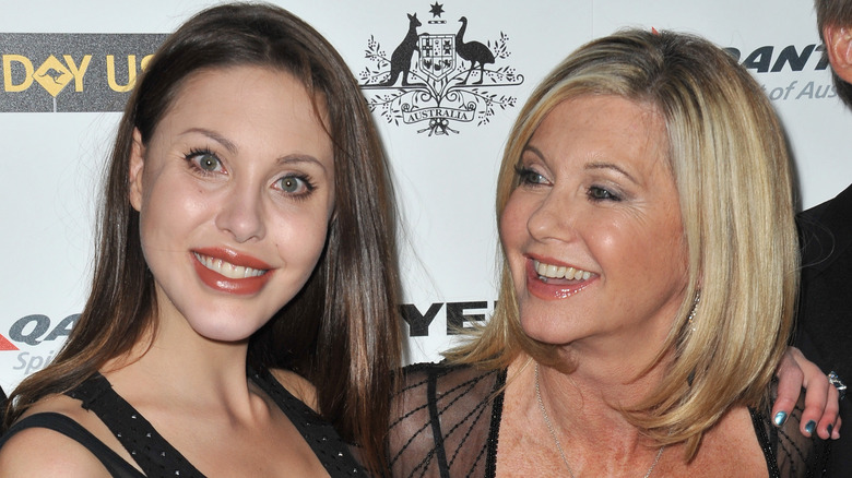 Chloe Lattanzi and Olivia Newton-John smile on the red carpet