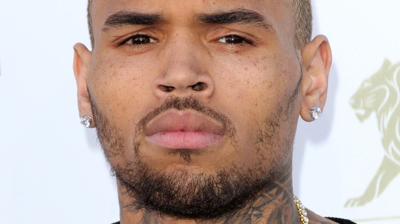 Chris Brown smirks
