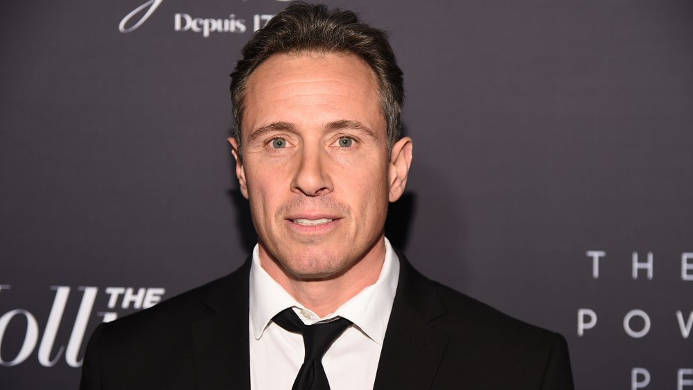 Chris Cuomo in black suite and white shirt