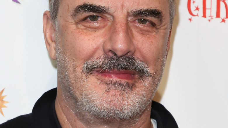 Chris Noth smiles