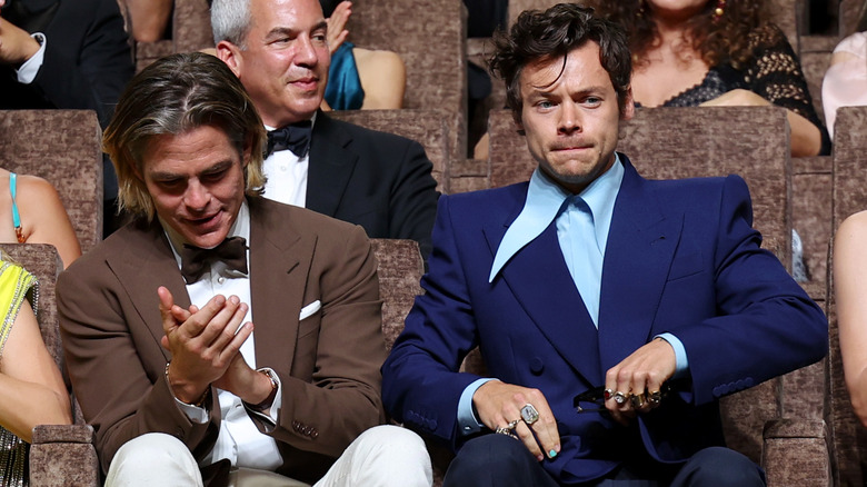 Chris Pine and Harry Styles sitting next to each other