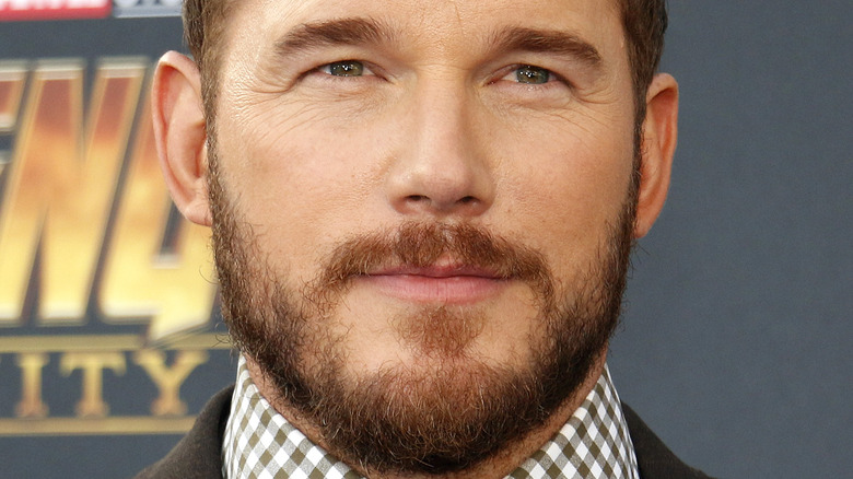 Chris Pratt smiles at an event