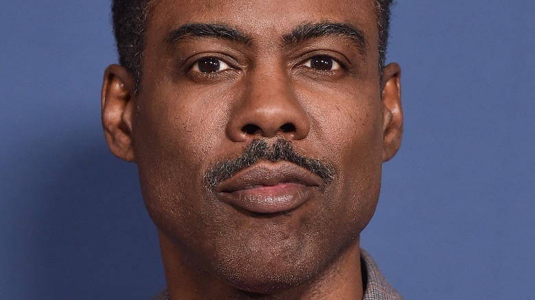 Chris Rock smirking