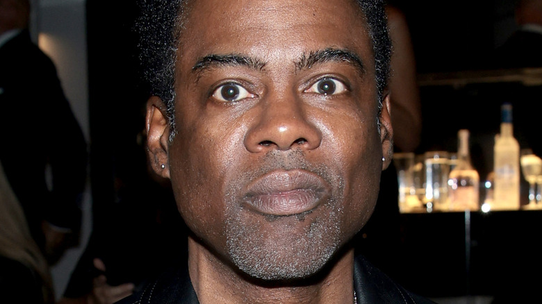 Chris Rock smirking