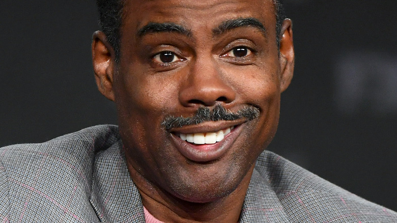 Chris Rock smirking