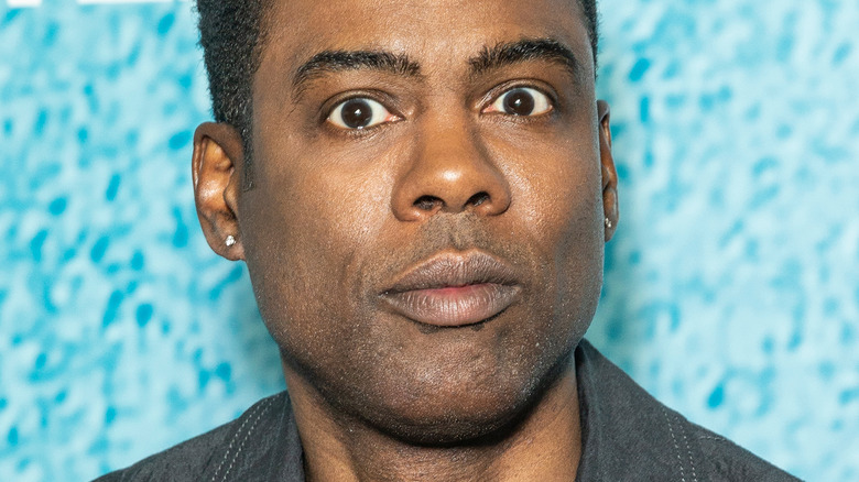 Chris Rock smirking