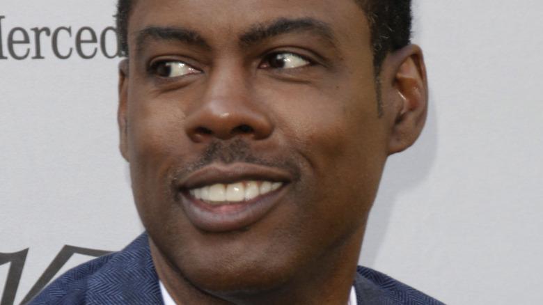 Chris Rock looking away