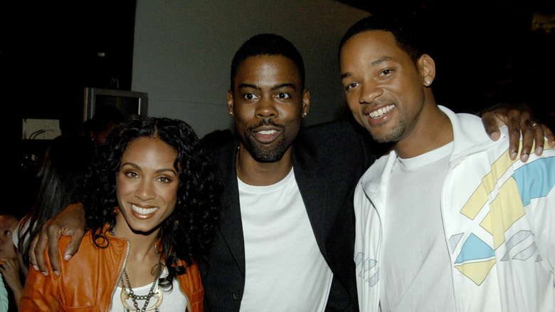Chris Rock posing with Jada Pinkett Smith and Will Smith