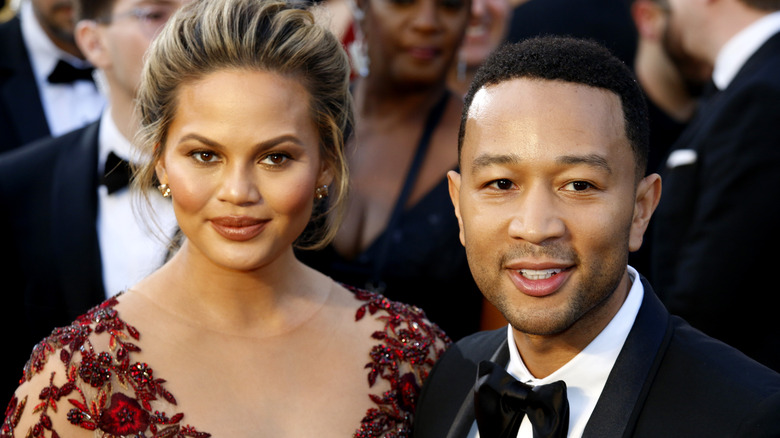Chrissy Teigen and John Legend posing