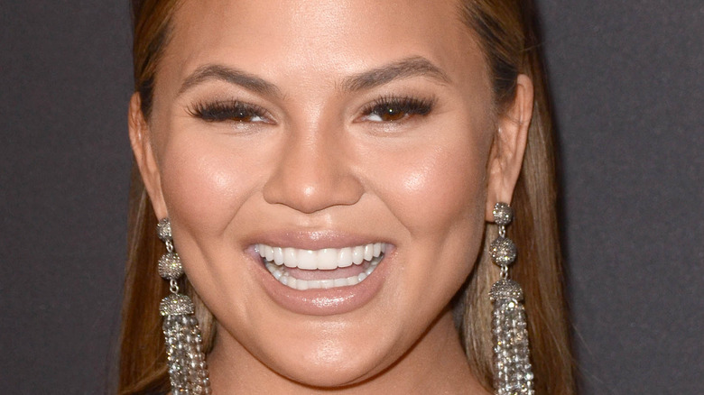 Chrissy Teigen smiling wide