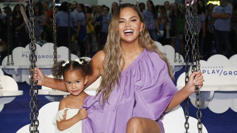 Chrissy Teigen with her daughter Luna