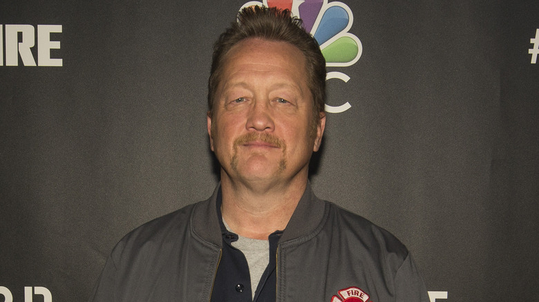 Christian Stolte posing in a jacket