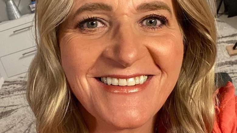 Christine Brown smiling with makeup