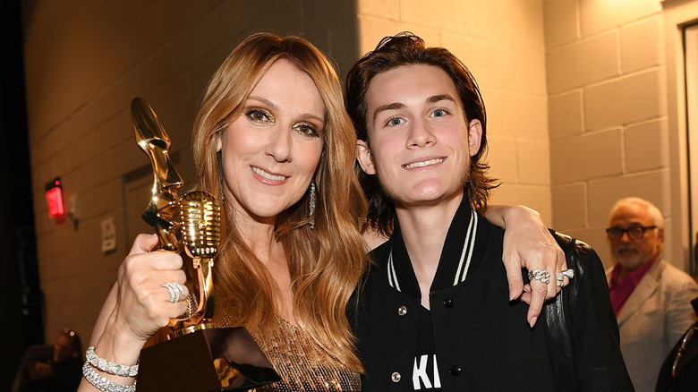 Céline Dion smiling and embracing her son René-Charles Angélil
