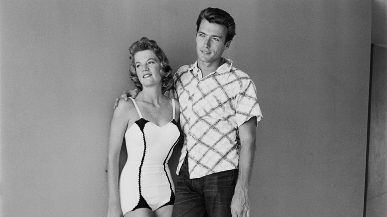 Maggie Johnson and Clint Eastwood posing for cameras