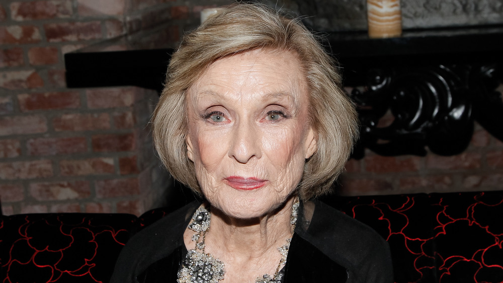 Cloris Leachman gives a faint smile to the camera
