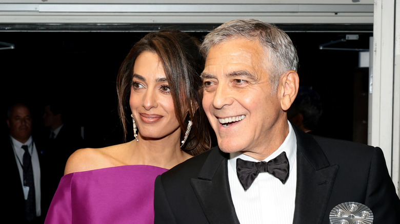 Amal Clooney and George Clooney on red carpet