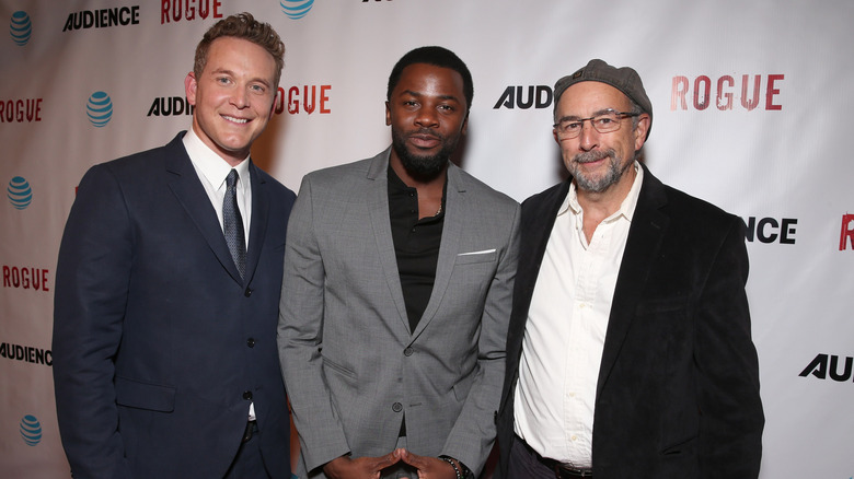 Cole Hauser posing on Rogue red carpet