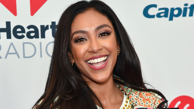 Tayshia Adams smiling on red carpet