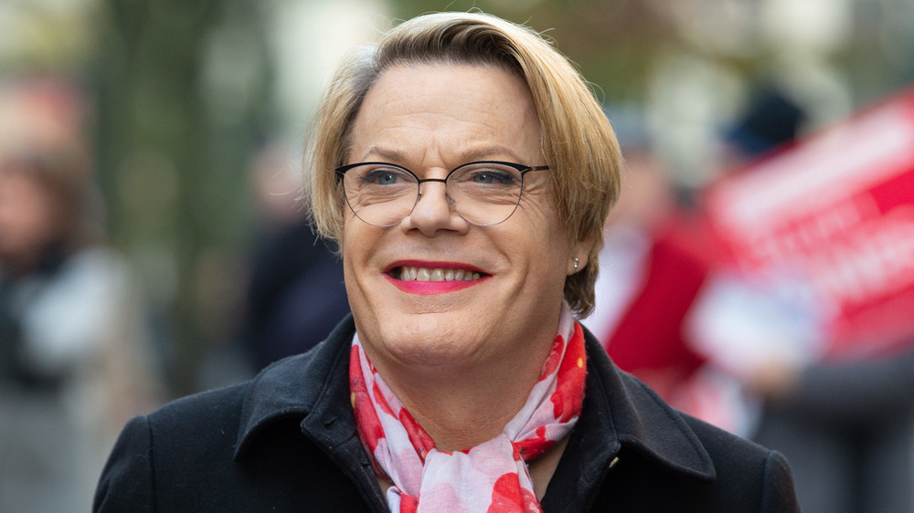 Eddie Izzard smiling in lipstick