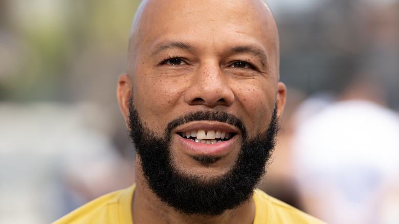 Common wearing a yellow t-shirt