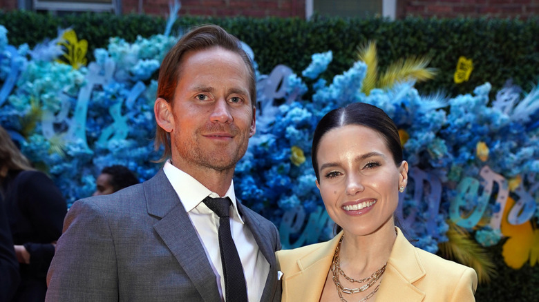 Grant Hughes and Sophia Bush smiling