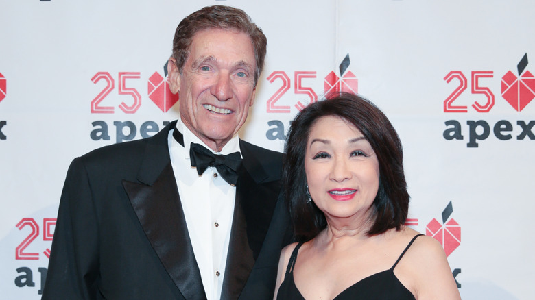Connie Chung and Maury Povich smiling at event