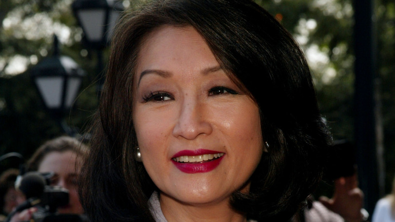Connie Chung smiling and looking away from the camera at event