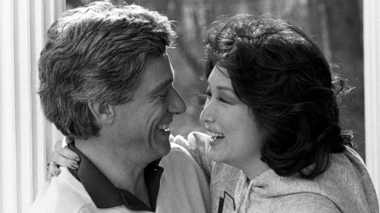 Connie Chung and Maury Povich smiling and looking at each other