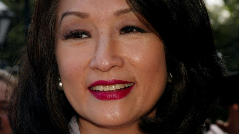 Connie Chung smiling and looking away from the camera at event