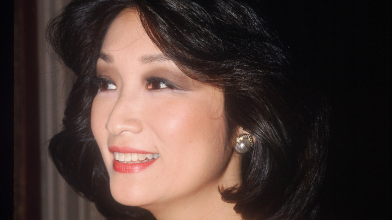 Connie Chung smiling and looking away from the camera at event