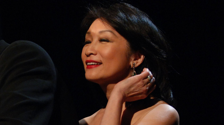 Maury Povich and Connie Chung staring away from camera at award show