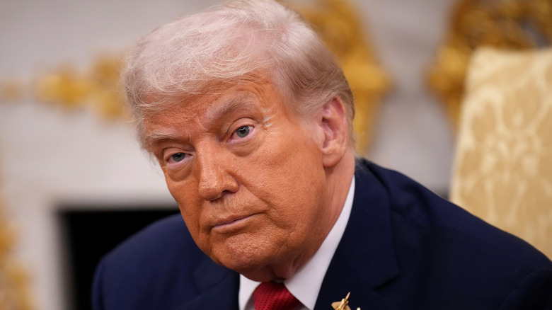 Donald Trump sitting in the oval office