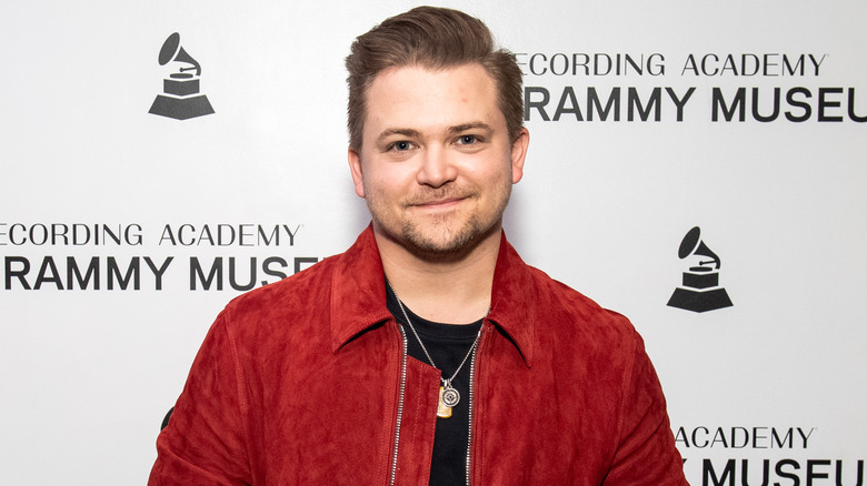 Hunter Hayes wearing red jacket