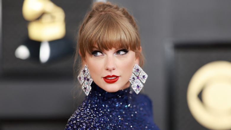 Taylor Swift wearing large diamond-shaped earrings