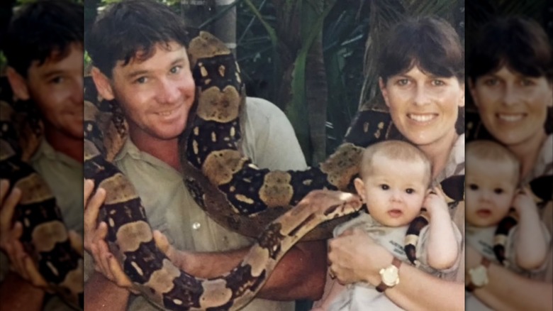 Steve Irwin and Terri Irwin holding a snake