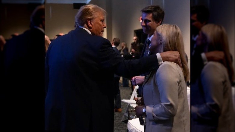 Donald Trump touching Karoline Leavitt's hair as they watch the 2024 election results.