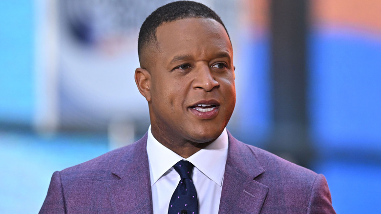 Craig Melvin speaking on the set of "Today" in a purple suit