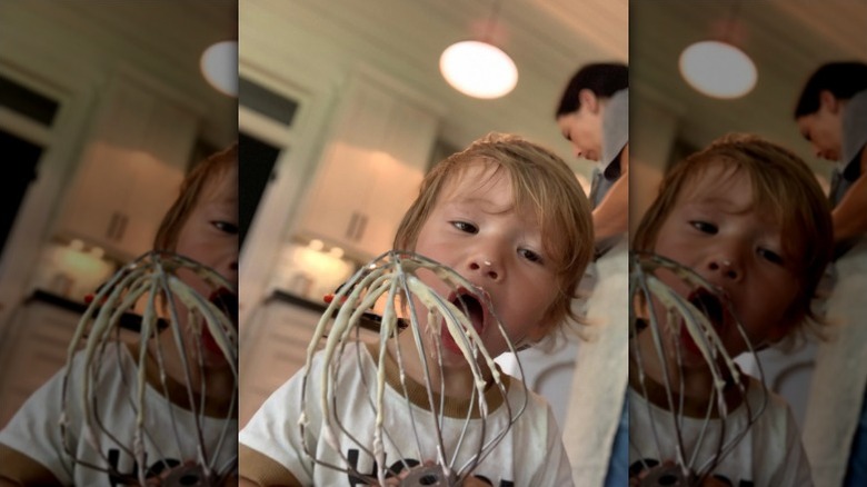 Crew Gaines licks batter from mixer part