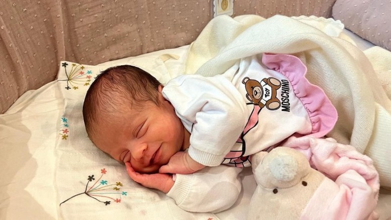 Bella Esmeralda sleeping in bassinet
