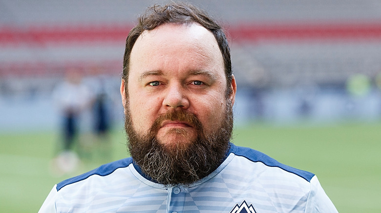 Chris Gauthier posing wearing a soccer jersey